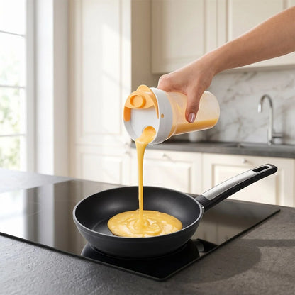 Pouring whisked eggs from the Tescoma DELÍCIA Egg Shaker into a pan